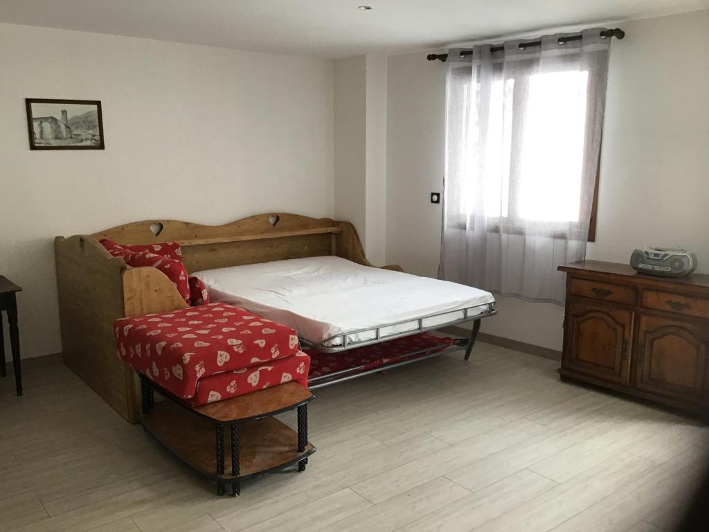 Postel nebo postele na pokoji v ubytování Chalet Chez Maxime Hameau l’Archaz Valloire