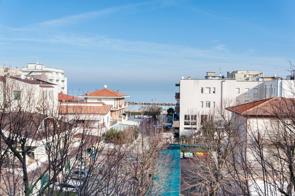 a view of a city with buildings at Residence Cigno in Rimini