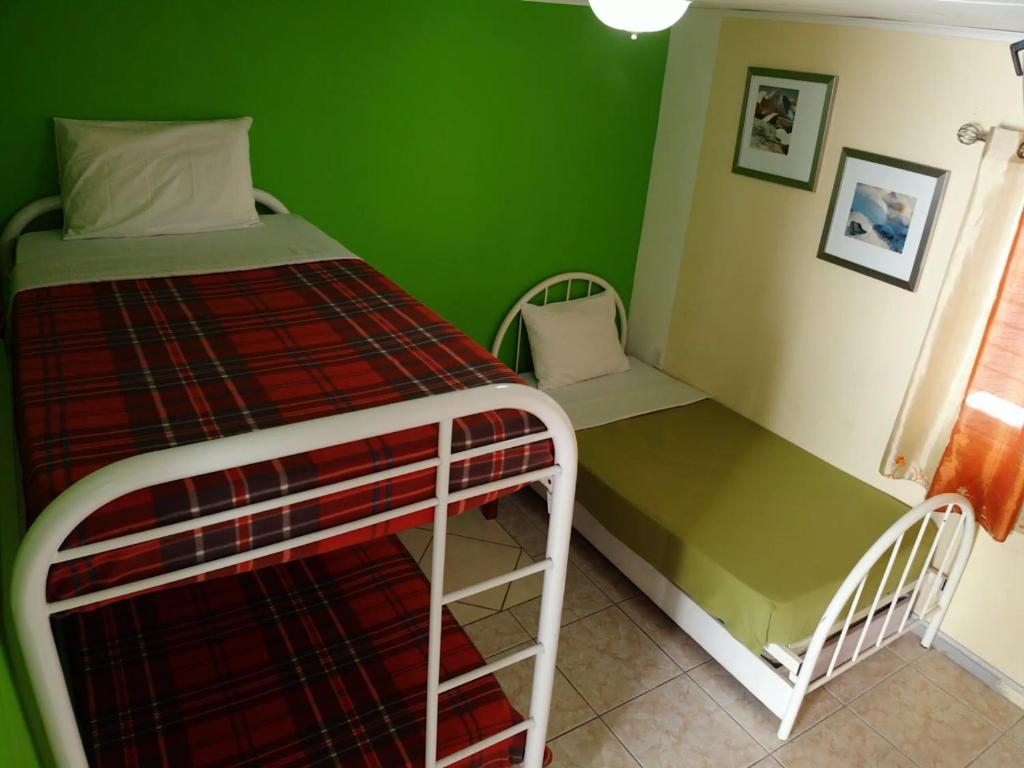 Postel nebo postele na pokoji v ubytování Hostel Room Aruba