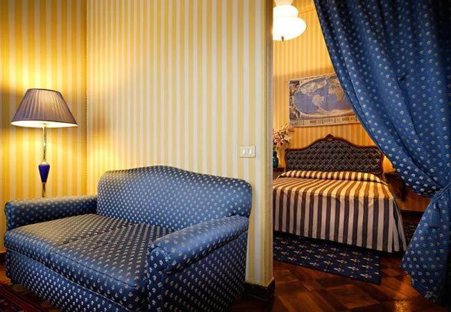 Postel nebo postele na pokoji v ubytování Centauro Hotel