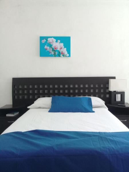 Letto o letti in una camera di Posada San Cristobal