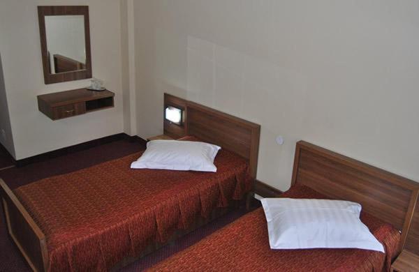 Postel nebo postele na pokoji v ubytování Hotel Iasicon