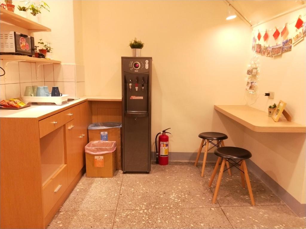Kuchyň nebo kuchyňský kout v ubytování Fuaowo Backpackers Homestay