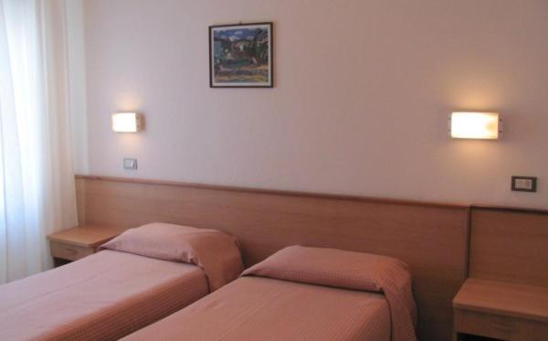 Postel nebo postele na pokoji v ubytování Albergo Moretti