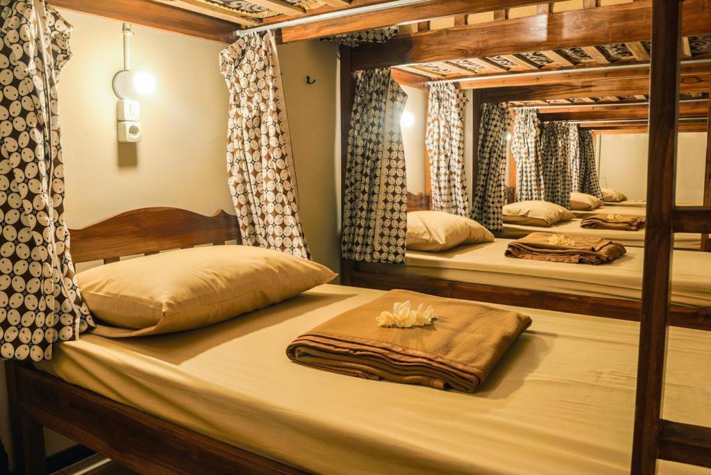 Ένα ή περισσότερα κρεβάτια σε δωμάτιο στο Rumah Larasati