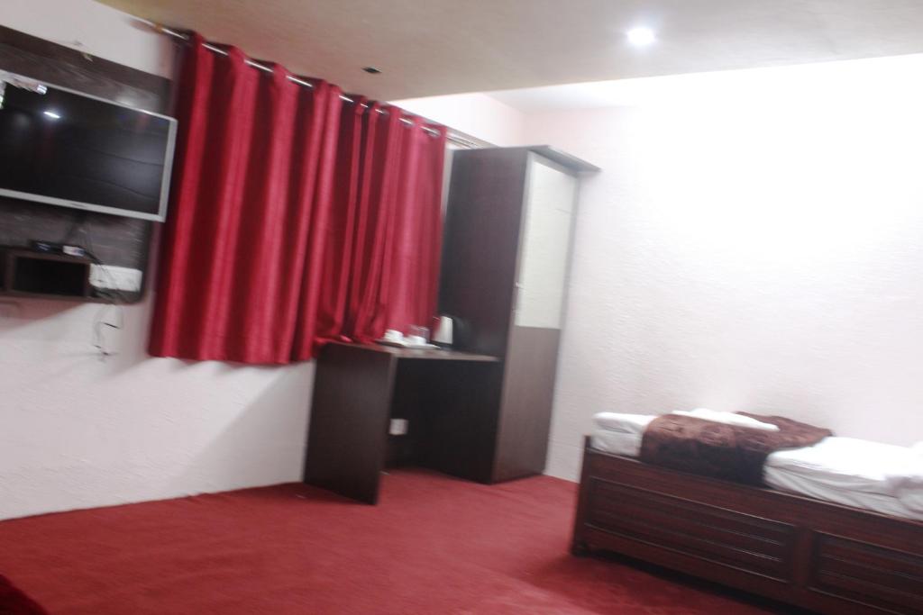 Postel nebo postele na pokoji v ubytování Hotel Paradiso
