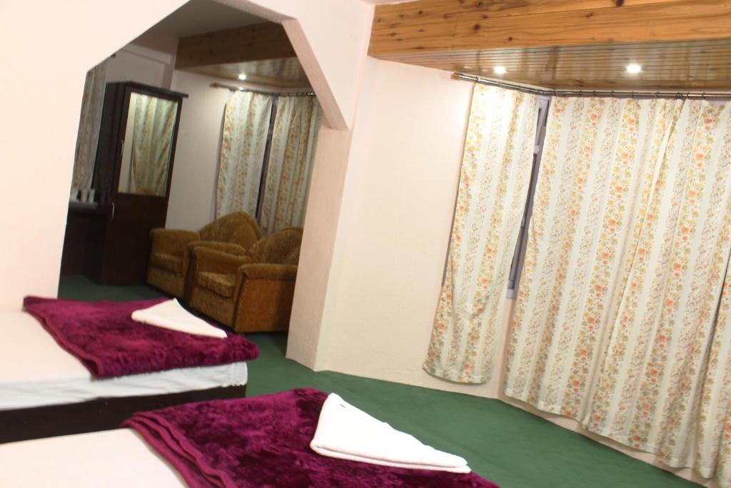 Postel nebo postele na pokoji v ubytování Hotel Paradiso
