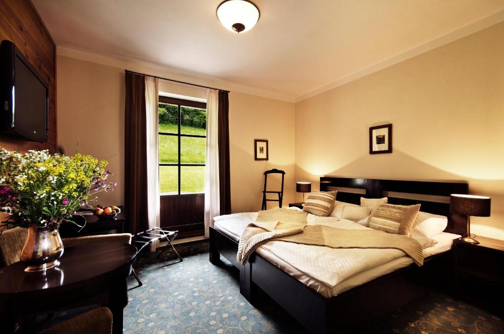 Postel nebo postele na pokoji v ubytování Hotel Annín