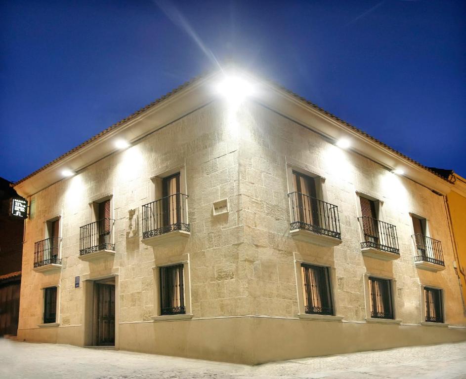 a building with a light on the side of it at Puerta del Sol in Ciudad-Rodrigo