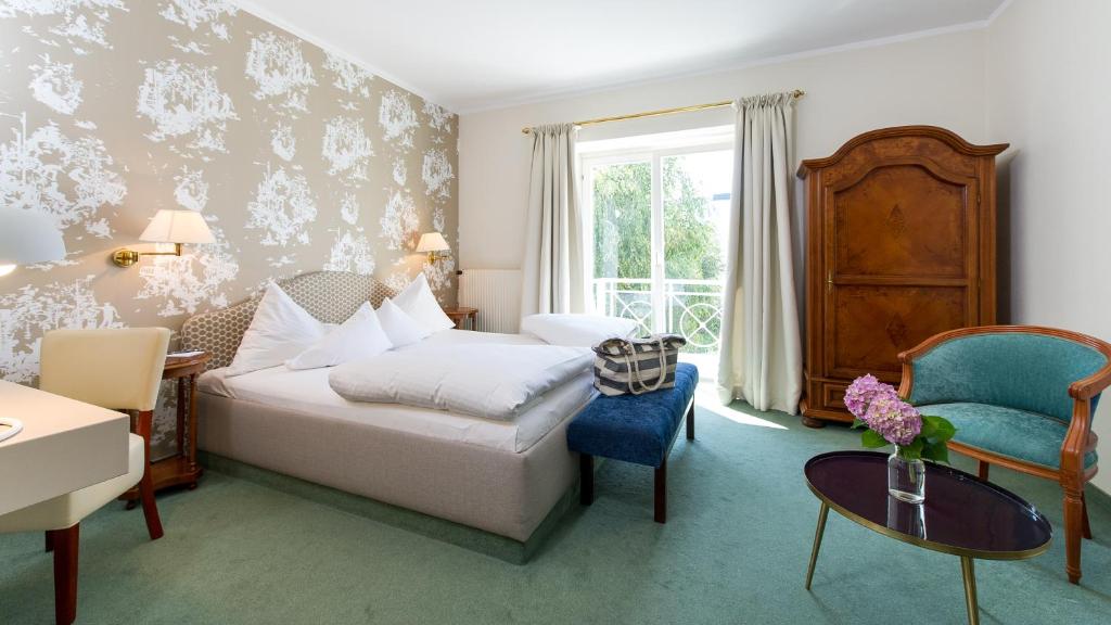 Postel nebo postele na pokoji v ubytování Dermuth Hotels – Hotel Dermuth Pörtschach