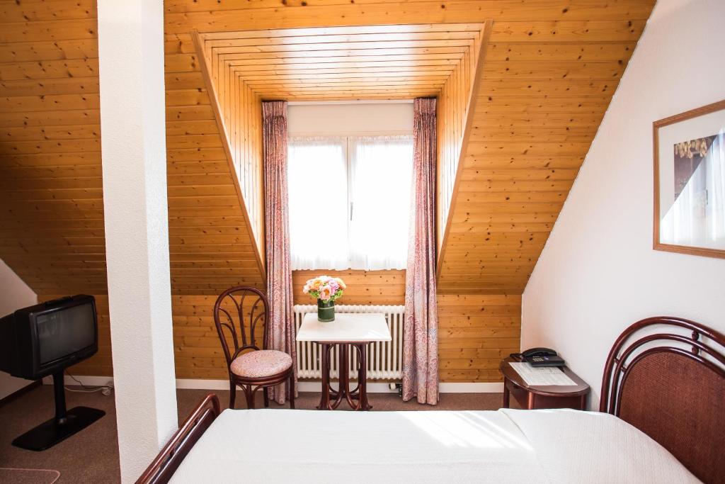 Postel nebo postele na pokoji v ubytování Hôtel Résidence Cité-Verdaine