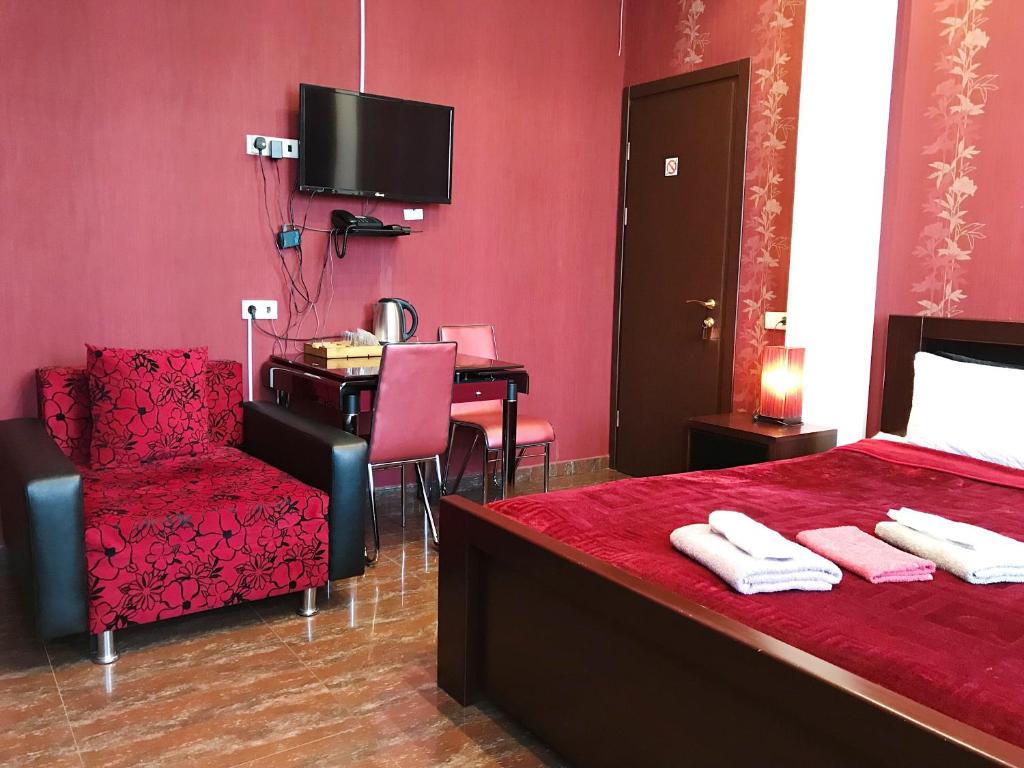 Postel nebo postele na pokoji v ubytování Hotel Aragvi