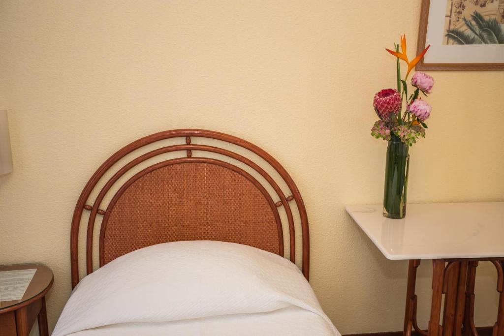 Postel nebo postele na pokoji v ubytování Hôtel Résidence Cité-Verdaine
