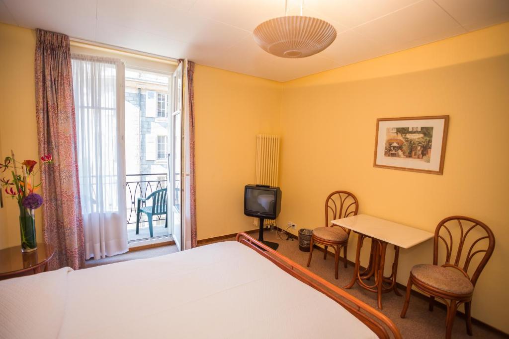 Postel nebo postele na pokoji v ubytování Hôtel Résidence Cité-Verdaine