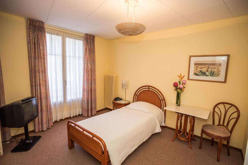 TV a/nebo společenská místnost v ubytování Hôtel Résidence Cité-Verdaine