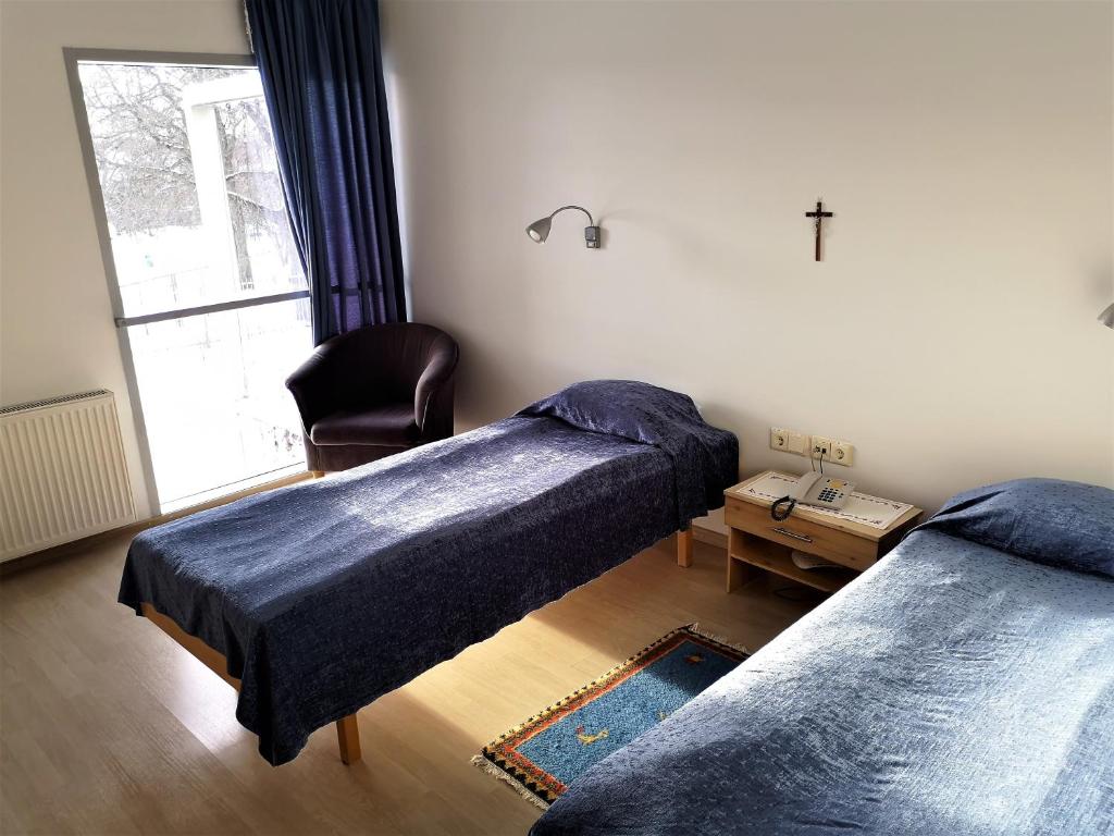Voodi või voodid majutusasutuse Pirita Klooster Guest House toas