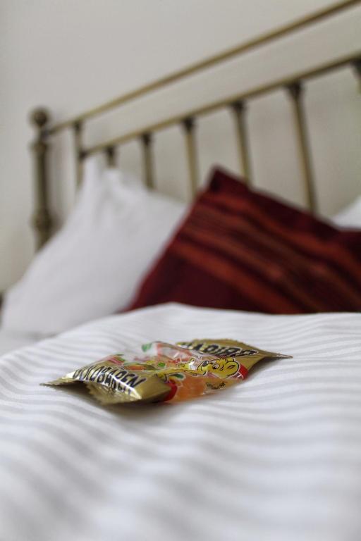 a bag of chips sitting on a bed at Akazienhof Hotel & Brauhaus in Cologne