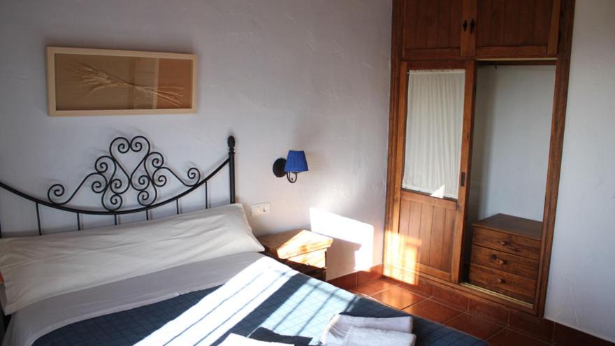 Postel nebo postele na pokoji v ubytování Casas Rurales Cortijo la Cañada