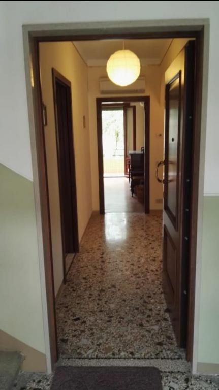 an empty hallway with a door leading to a room at Lido di Venezia Mare e Cinema in Venice-Lido
