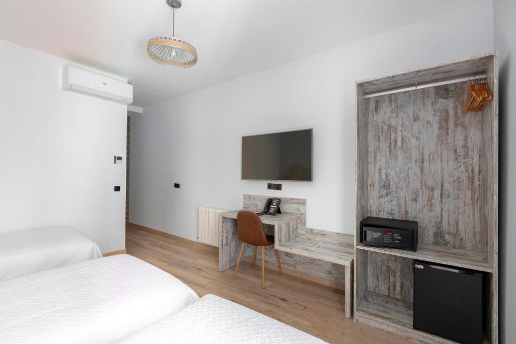 TV a/nebo společenská místnost v ubytování Hostal Anton Martin