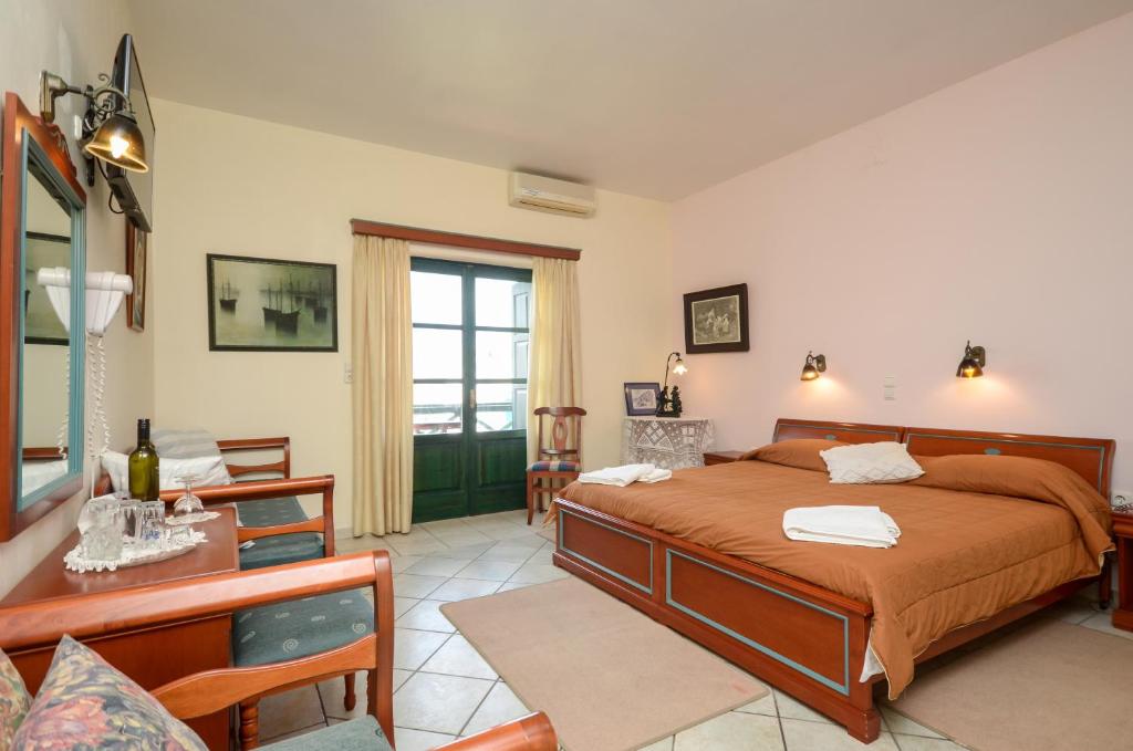 Postel nebo postele na pokoji v ubytování Apollon Hotel