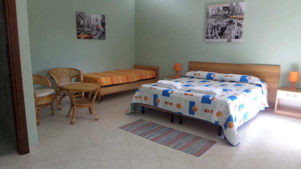 Letto o letti in una camera di B&B La Posada Stintino