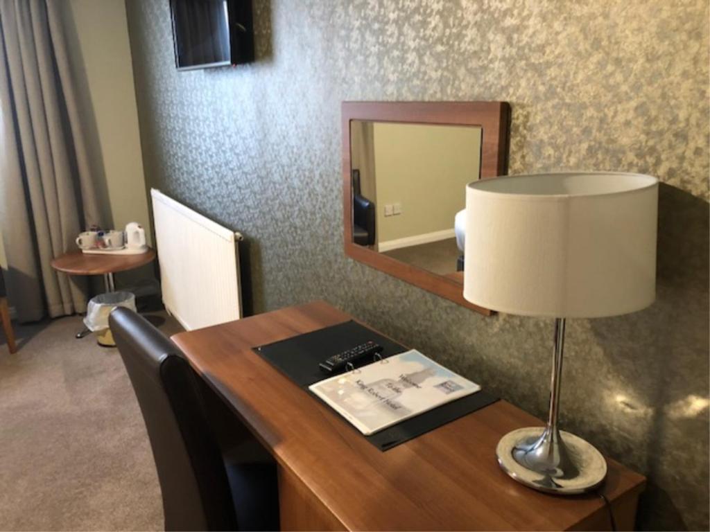 TV a/nebo společenská místnost v ubytování King Robert Hotel