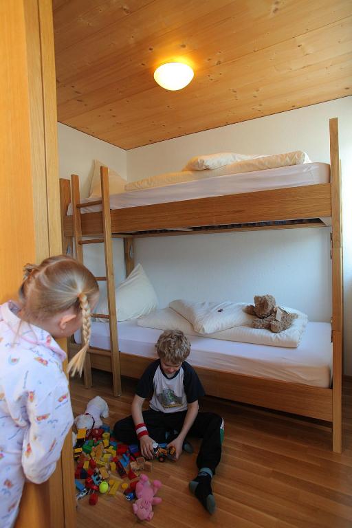 Postel nebo postele na pokoji v ubytování Sonne Bezau - Familotel Bregenzerwald