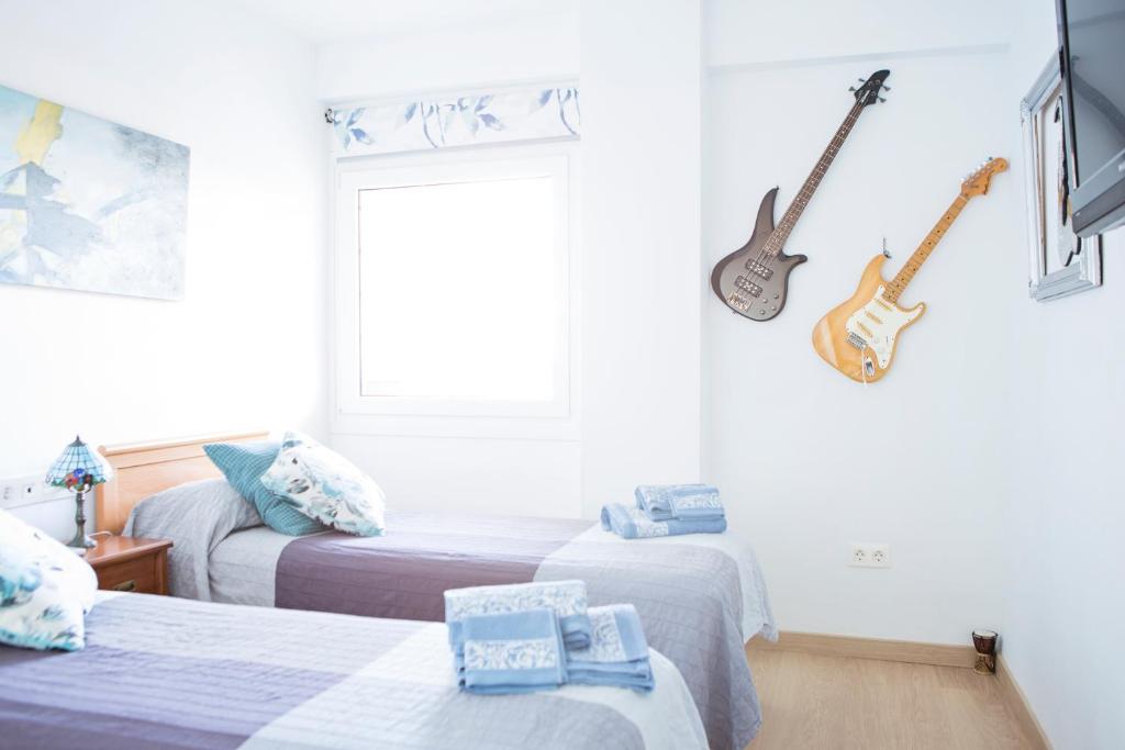 Posteľ alebo postele v izbe v ubytovaní Apartamento Lujo frente al Mar Centro de Malaga