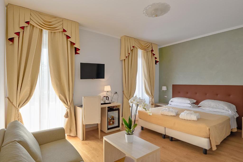 Postel nebo postele na pokoji v ubytování Hotel Paradiso