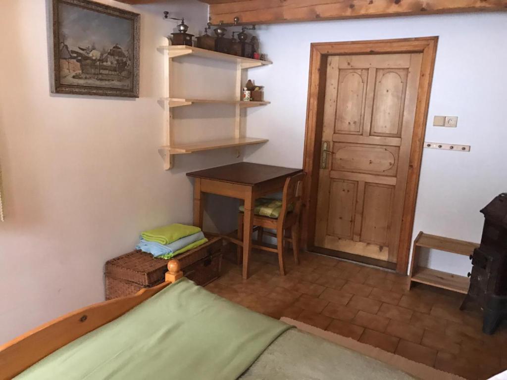 Łóżko lub łóżka w pokoju w obiekcie Chalupa Pod Skalou I.