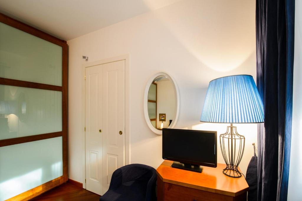 Televízia a/alebo spoločenská miestnosť v ubytovaní Sana Luxury Apartment