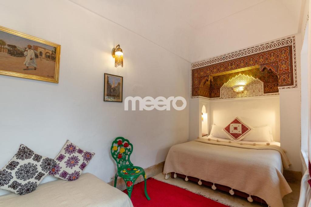Postel nebo postele na pokoji v ubytování Riad Zineb