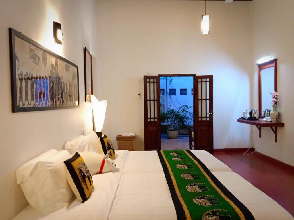 Postel nebo postele na pokoji v ubytování Kaya Residence Kandy