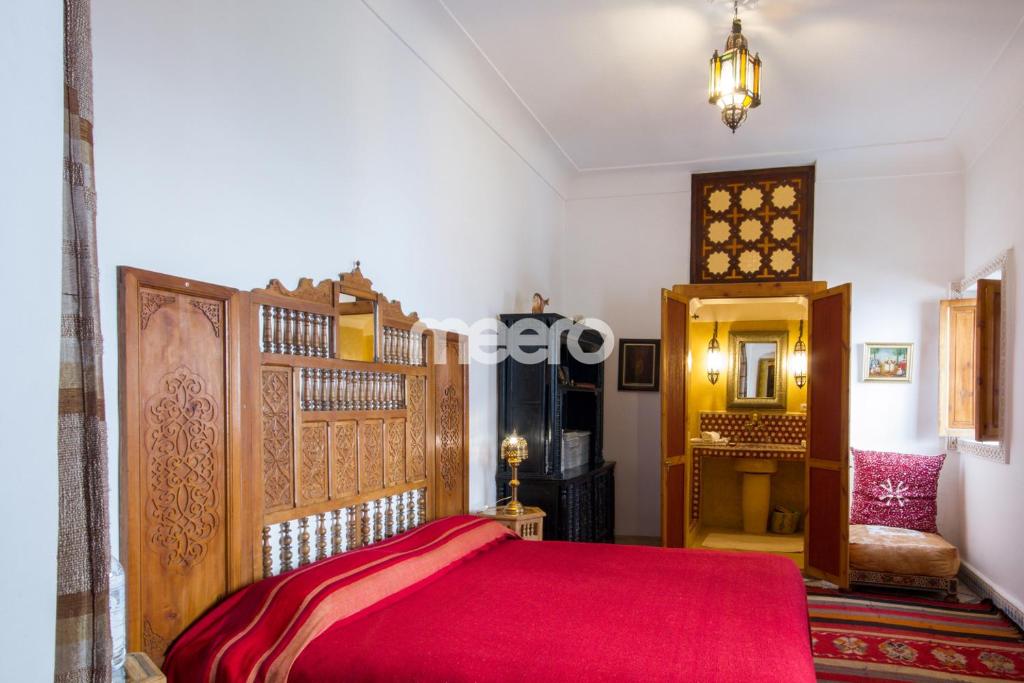 Postel nebo postele na pokoji v ubytování Riad Zineb
