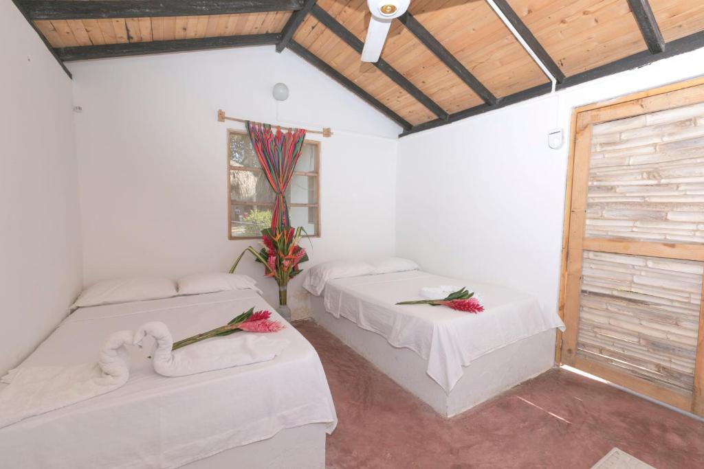 Postel nebo postele na pokoji v ubytování Casa Grande Surf