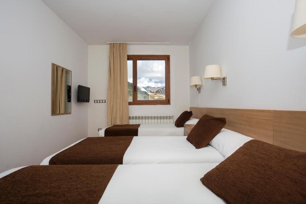 Voodi või voodid majutusasutuse Hotel Catalunya Ski toas