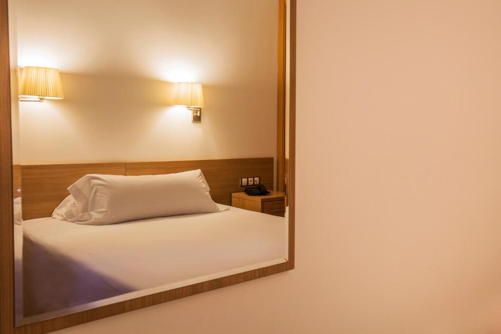 Voodi või voodid majutusasutuse Hotel Catalunya Ski toas