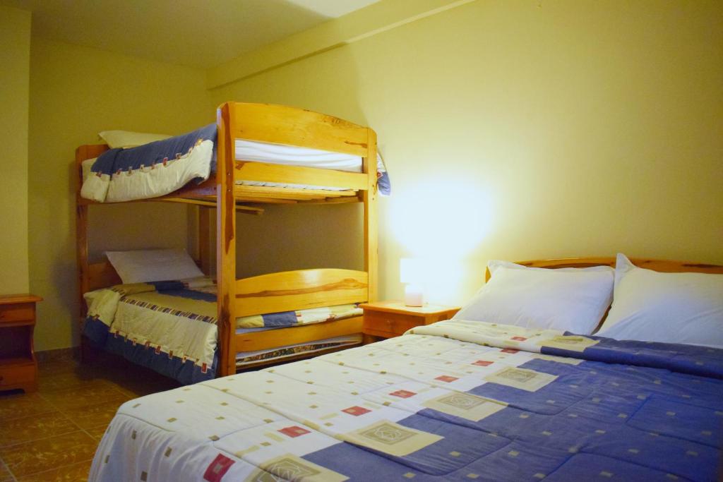 Postel nebo postele na pokoji v ubytování Meraki Hotel