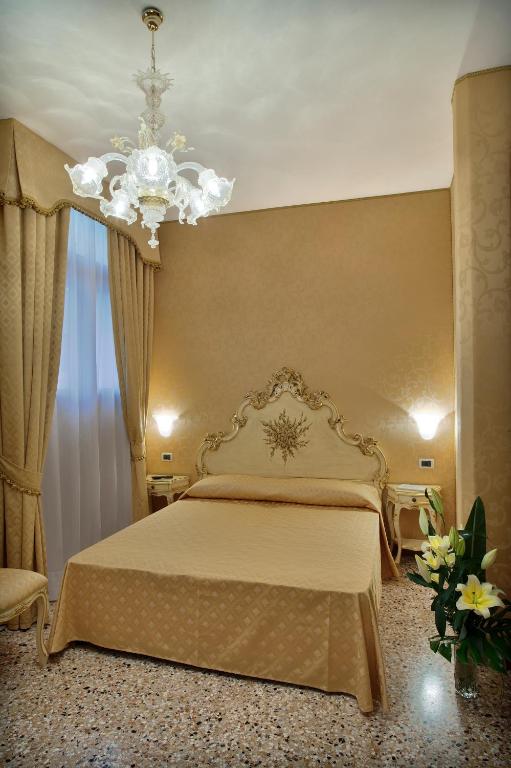 Postel nebo postele na pokoji v ubytování Hotel Al Malcanton
