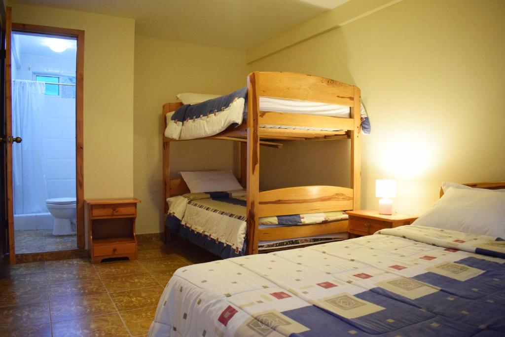 Postel nebo postele na pokoji v ubytování Meraki Hotel