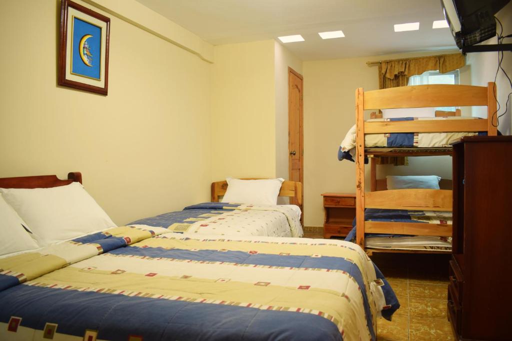 Postel nebo postele na pokoji v ubytování Meraki Hotel