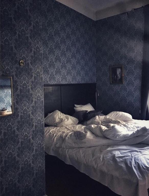 Postel nebo postele na pokoji v ubytování Morris Hotel