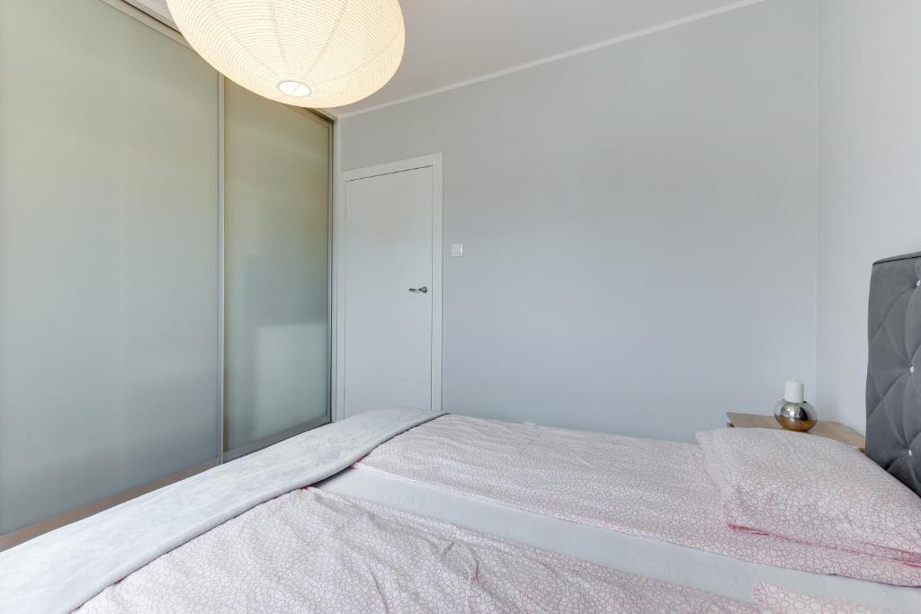 Posteľ alebo postele v izbe v ubytovaní Apartament Stylowy