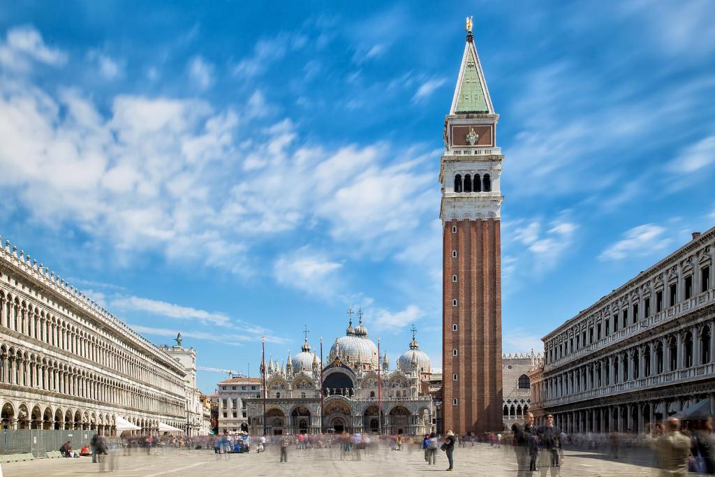 a clock tower in the middle of a city at Hotel Mezzo Pozzo in Venice