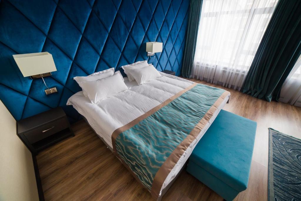 Postel nebo postele na pokoji v ubytování Golden Hotel