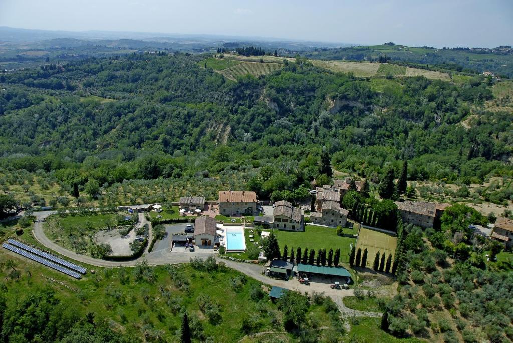 an aerial view of a house in a forest at Fattoria Pogni in Marcialla