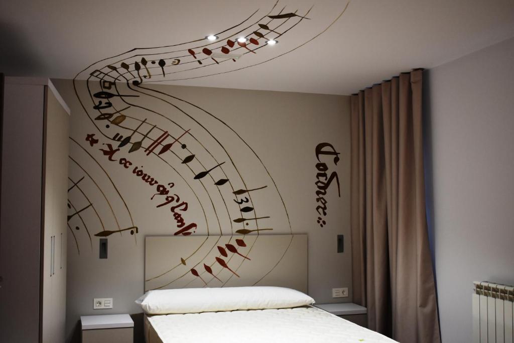 Posteľ alebo postele v izbe v ubytovaní Apartamentos Turísticos Pueri Cantores