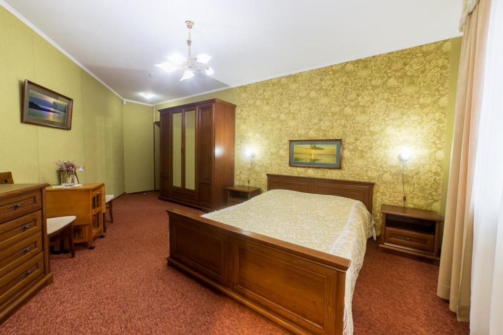 Postel nebo postele na pokoji v ubytování Hotel Premyer