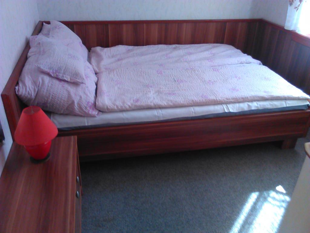 Łóżko lub łóżka w pokoju w obiekcie Family Home Apartment